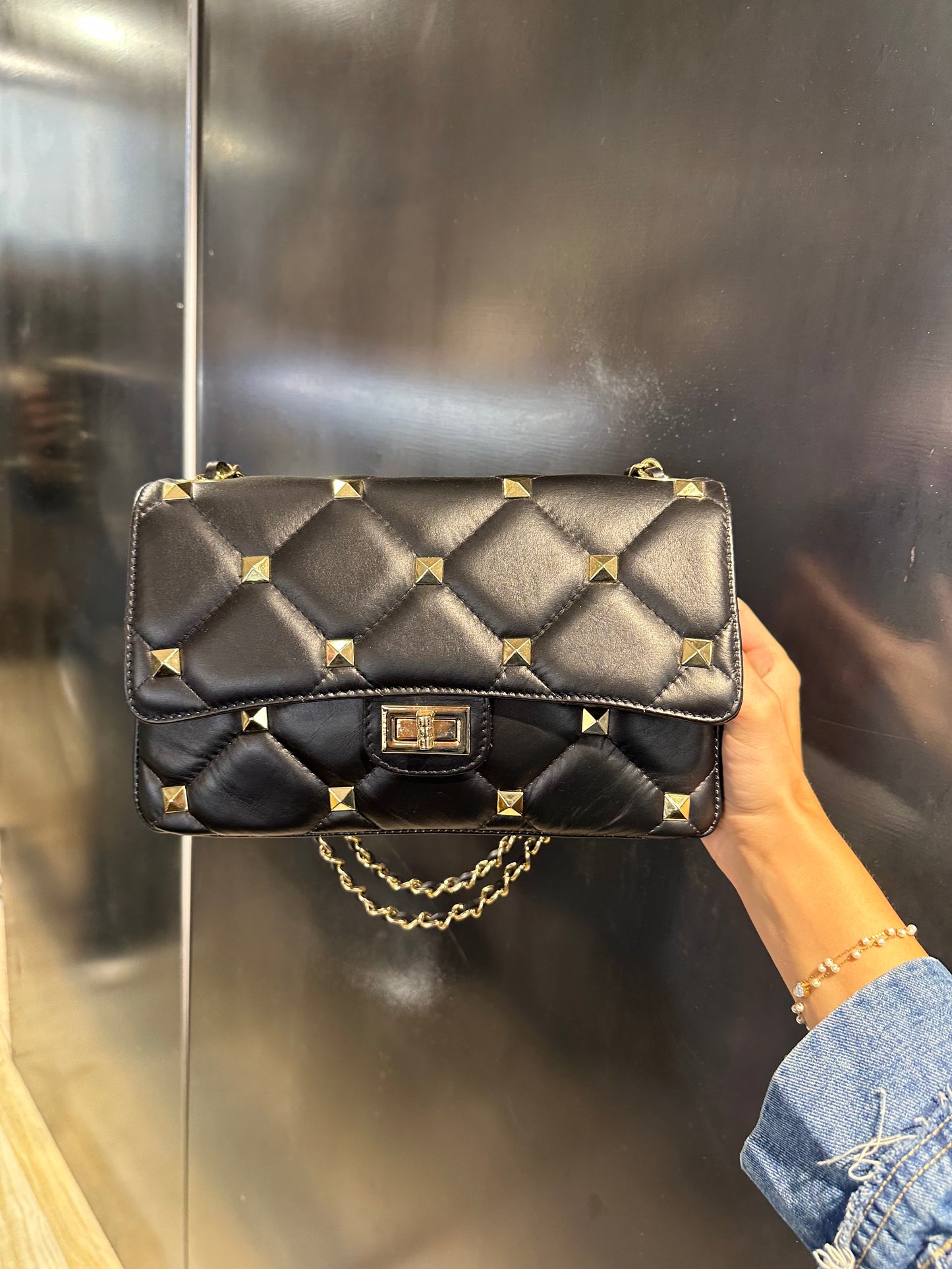 Borsa in vera pelle borchiata