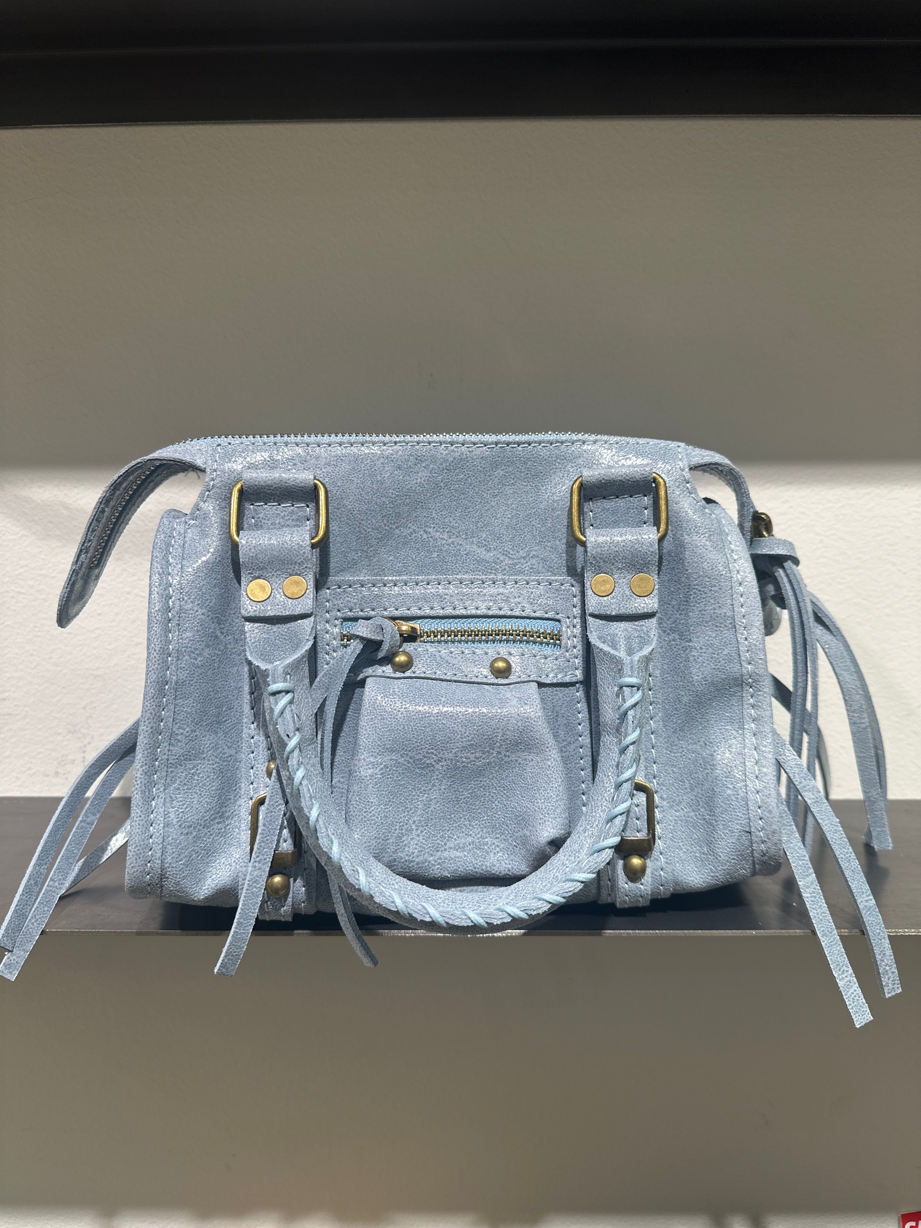 Minibag in pelle con borchie tonde e lacci